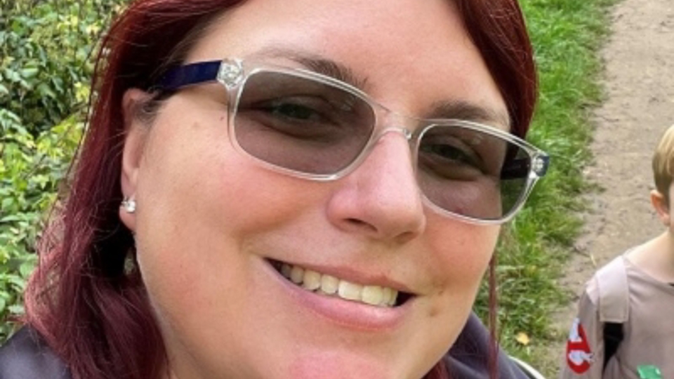 Emma Burdette smiling in glasses