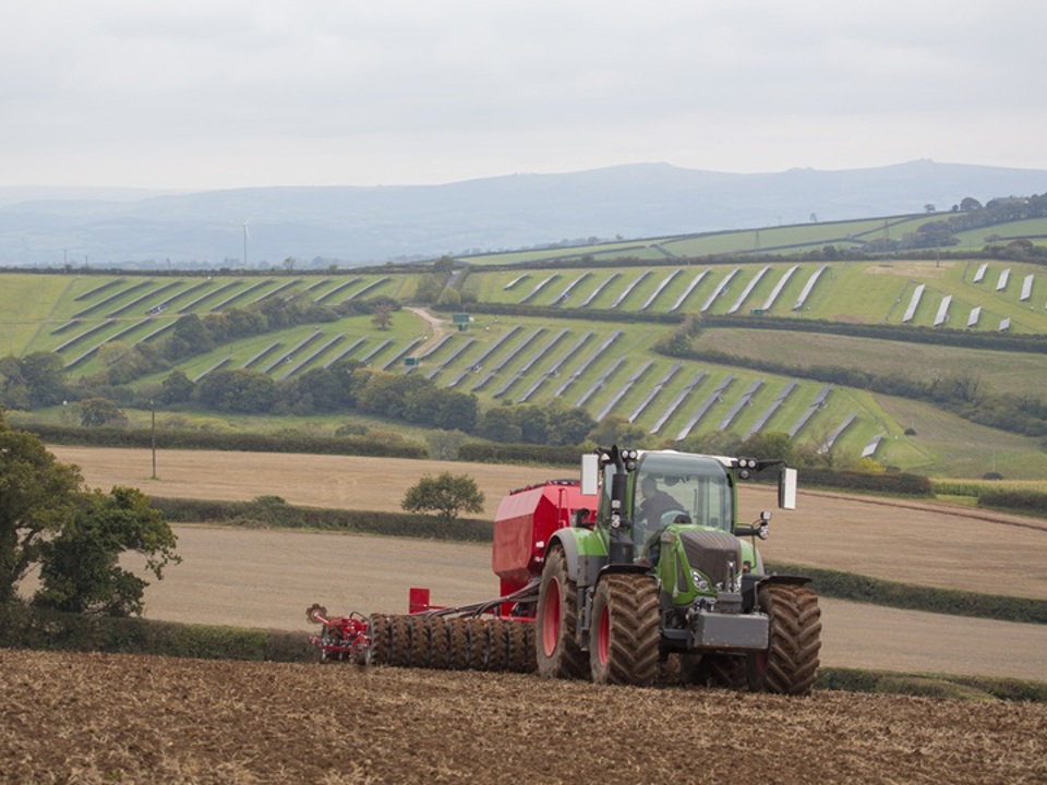 Tractor going across field