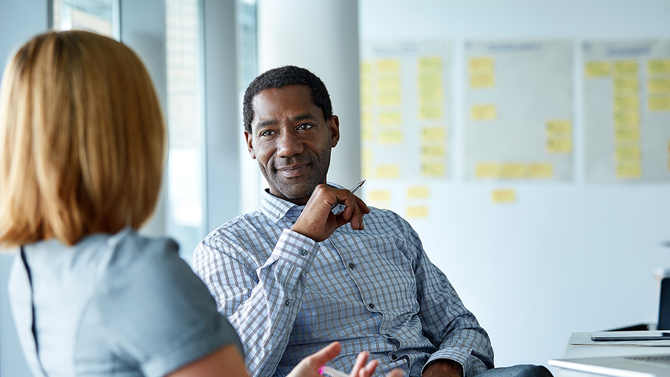 Man and woman sitting down talking