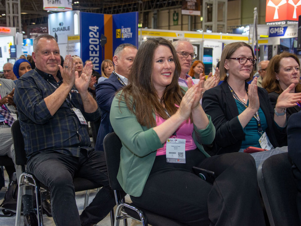 Crowd clapping at safety and health exhibition