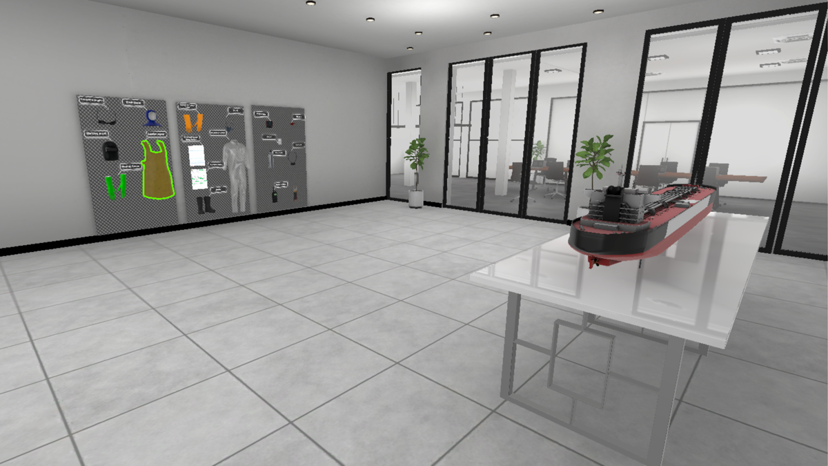 A virtual reality training environment depicting a modern office space. The room has light gray tiled flooring and white walls, with large glass partitions revealing an adjacent office area. On the left wall, there is a display board featuring various safety equipment, including gloves, a high-visibility vest, and protective clothing. In the foreground, a white table holds a detailed scale model of a red and black cargo ship. Two potted plants are placed near the glass partitions for decoration.