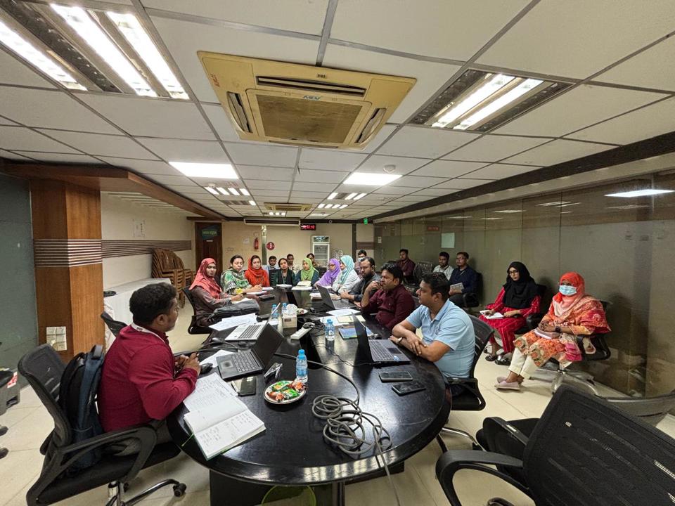 Safety professionals attending a training meeting around a conference table.