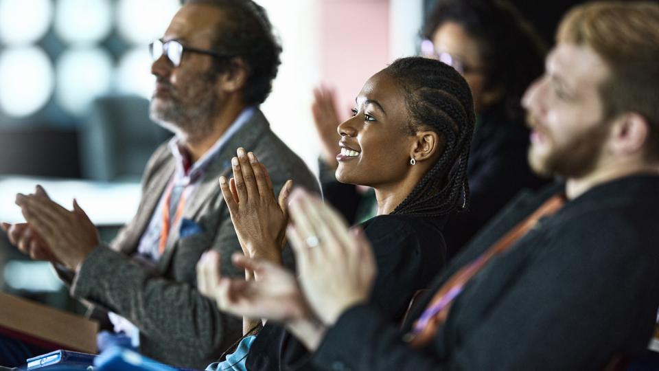 Crowd clapping at an event